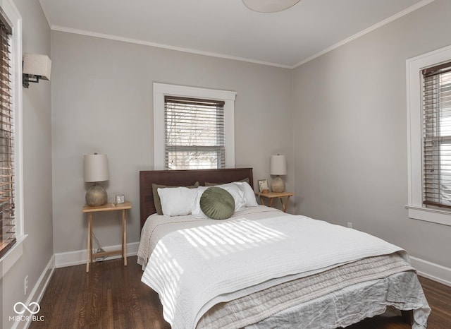 bedroom with dark wood-type flooring, baseboards, and ornamental molding