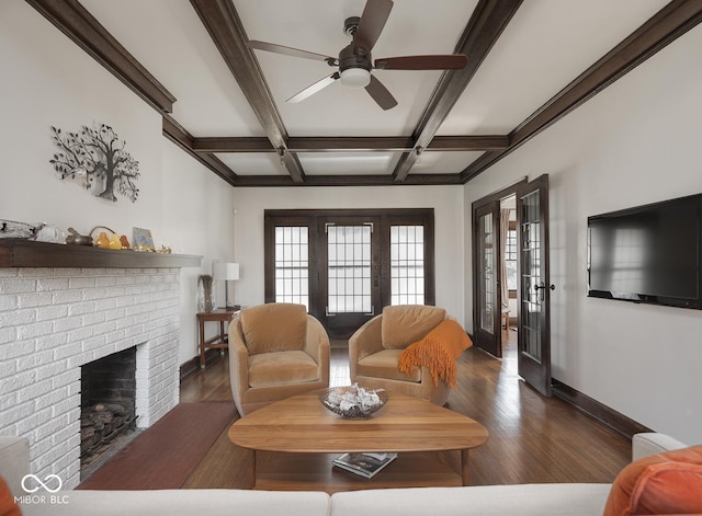 living room featuring beam ceiling, coffered ceiling, wood finished floors, french doors, and baseboards