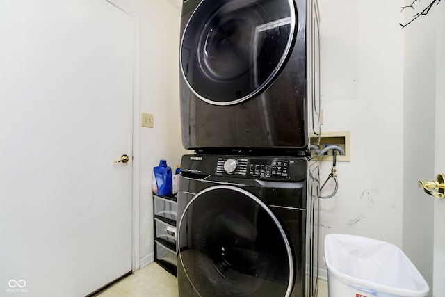 laundry area with stacked washer and dryer