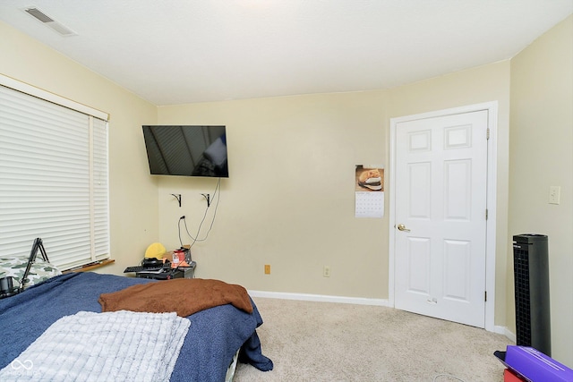 bedroom with light colored carpet