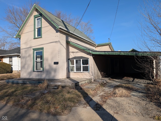 view of home's exterior featuring a carport