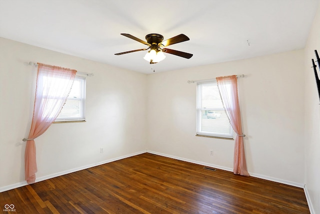 unfurnished room featuring ceiling fan and dark hardwood / wood-style flooring