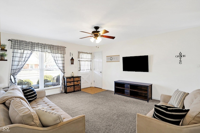 carpeted living room featuring ceiling fan