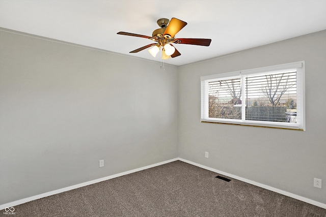 empty room with ceiling fan and carpet floors