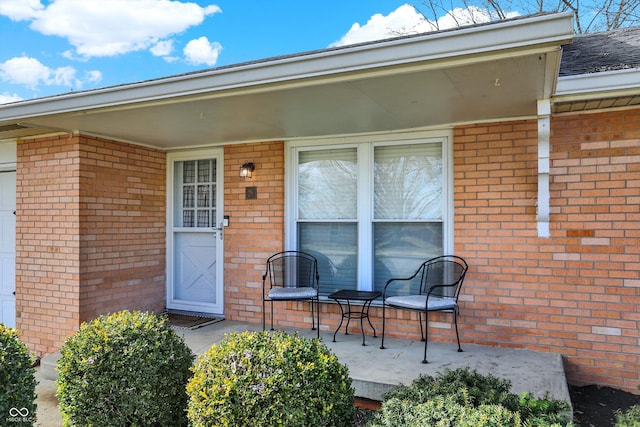 entrance to property featuring a patio area