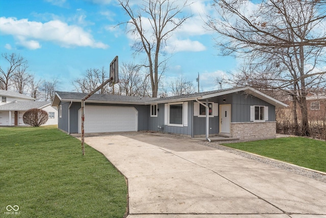 ranch-style home with board and batten siding, an attached garage, driveway, and a front lawn