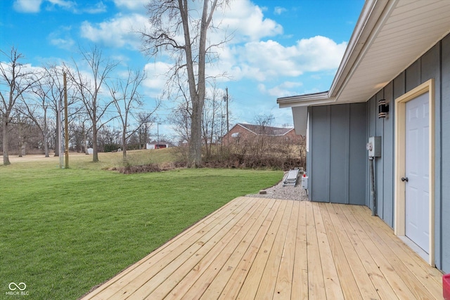 wooden terrace with a yard