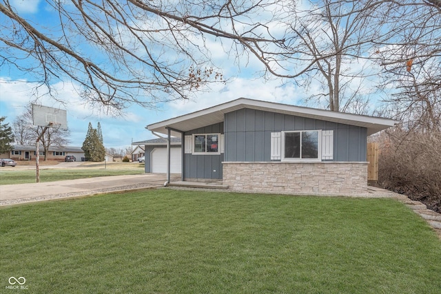 view of front facade featuring stone siding, concrete driveway, board and batten siding, and a front yard