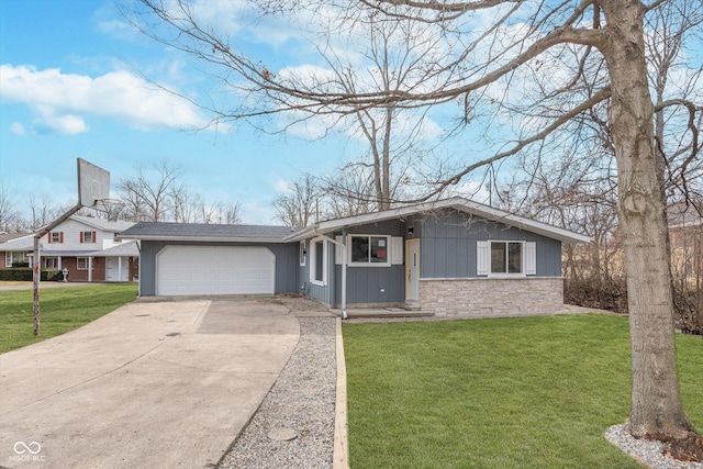 view of front of house featuring concrete driveway, stone siding, an attached garage, a front lawn, and board and batten siding