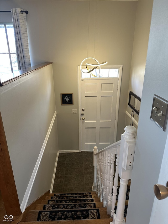 doorway to outside with a healthy amount of sunlight and baseboards