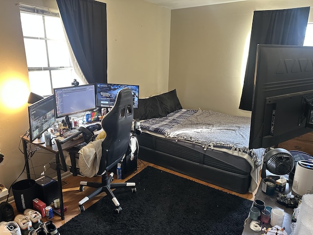 bedroom with wood finished floors