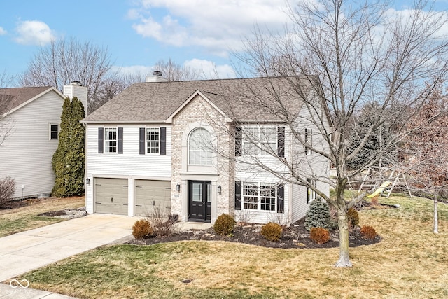 colonial-style house featuring a front yard and a garage