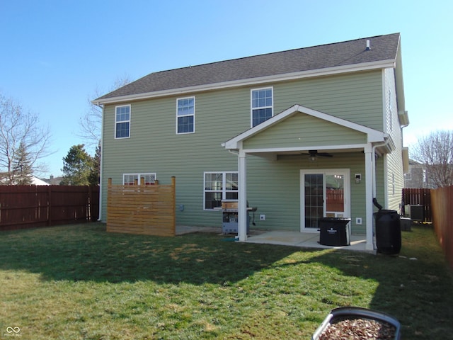 back of property featuring ceiling fan, a yard, a patio, and central air condition unit