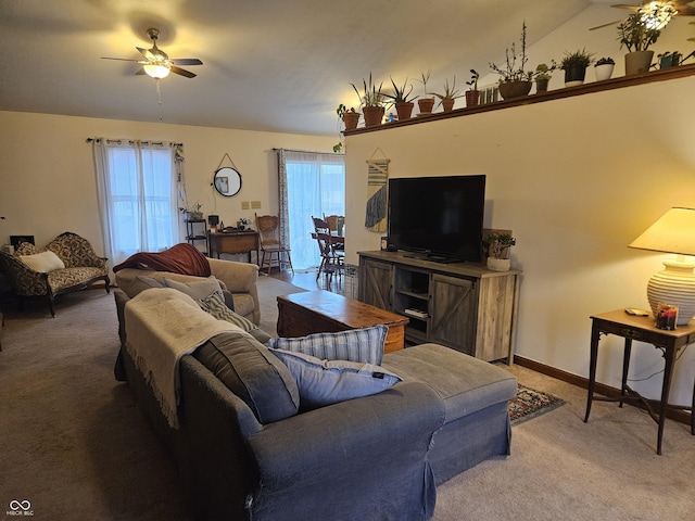 living room with vaulted ceiling, carpet flooring, and ceiling fan