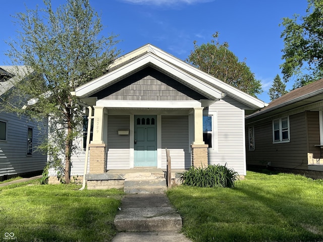 2029 Laurel St, Indianapolis, IN 46203 - view of front of home featuring covered porch and a front lawn