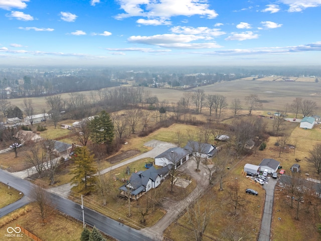 birds eye view of property featuring a rural view