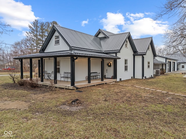 view of front of property featuring central AC, a front lawn, and a porch