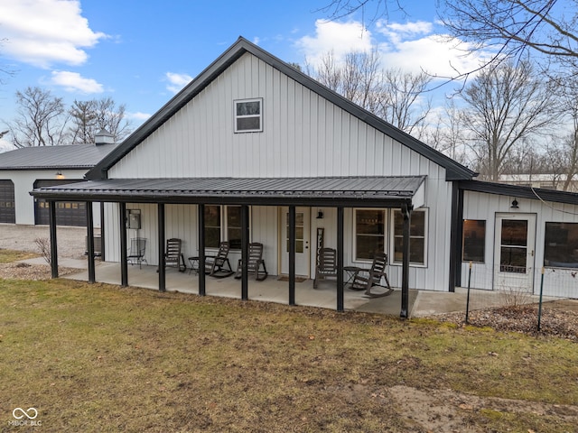 view of front facade with a patio and a front yard