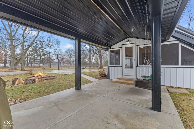 view of patio with a sunroom