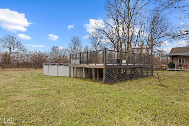 view of yard with a pool side deck