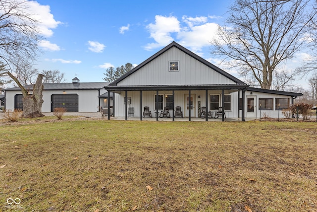 view of front facade with a garage, a front yard, and a patio area