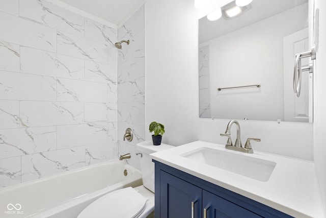 full bathroom with vanity, toilet, and tiled shower / bath