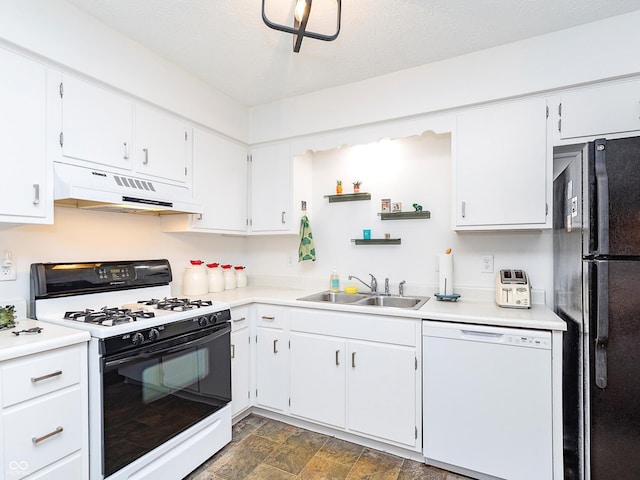 kitchen with sink, dishwasher, white cabinetry, gas stove, and black fridge