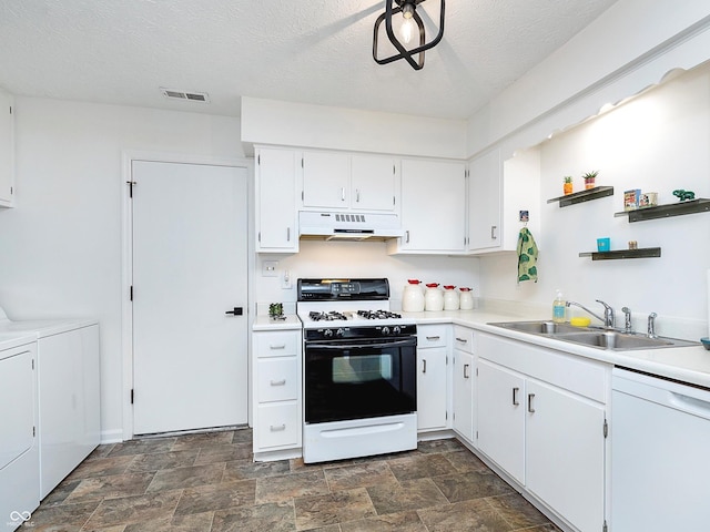 kitchen featuring sink, white dishwasher, white cabinets, washing machine and clothes dryer, and range with gas cooktop