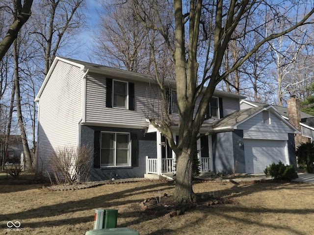 front of property featuring a garage and a front yard