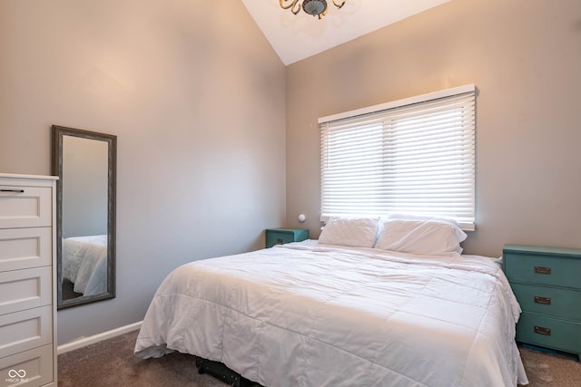 bedroom with vaulted ceiling and dark carpet