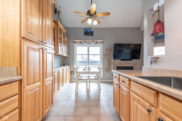 kitchen with light tile patterned flooring, ceiling fan, and pendant lighting