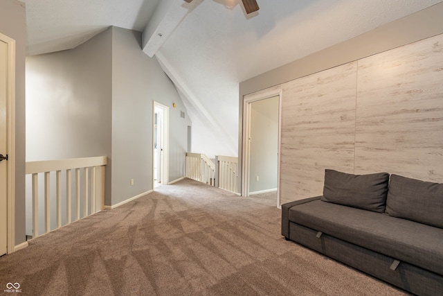 unfurnished living room with lofted ceiling with beams, carpet floors, and ceiling fan