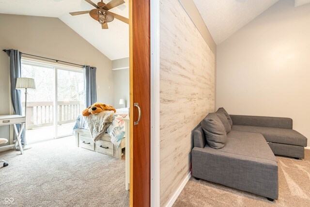 living area featuring light carpet, vaulted ceiling, and ceiling fan