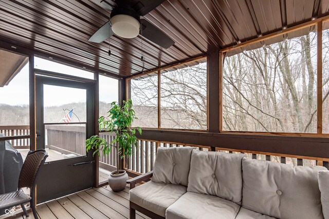 sunroom featuring ceiling fan