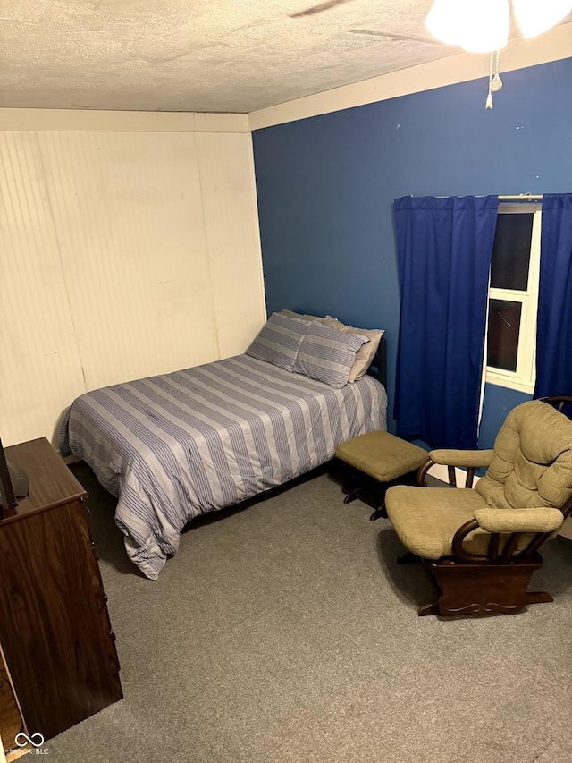 carpeted bedroom featuring a textured ceiling