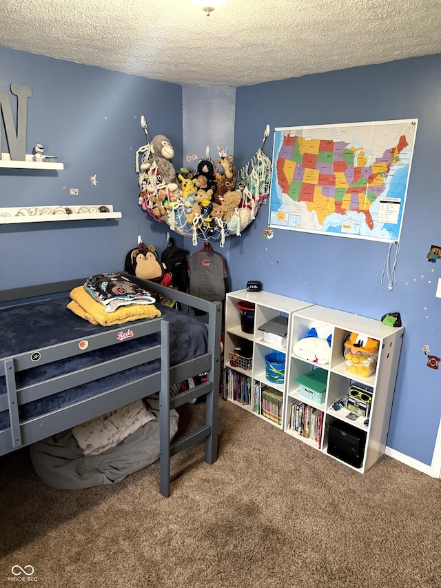 carpeted bedroom with a textured ceiling