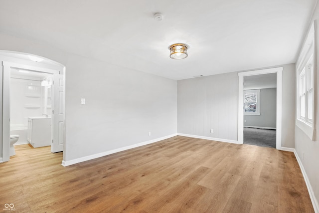 unfurnished room with light hardwood / wood-style floors