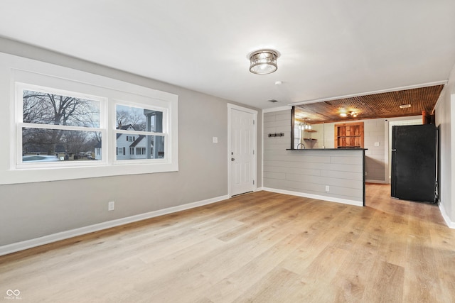 unfurnished living room with light wood-type flooring