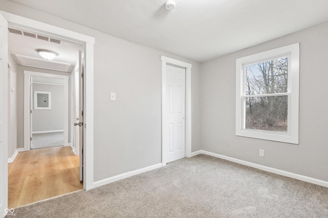 unfurnished bedroom with carpet flooring and a closet