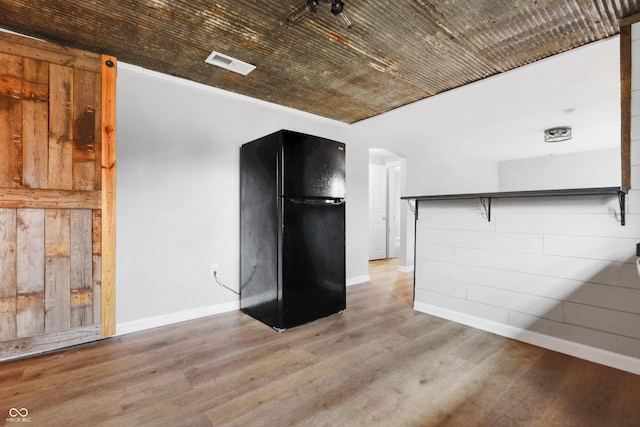 unfurnished living room featuring light hardwood / wood-style floors