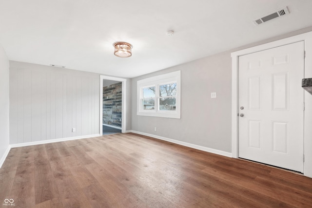 spare room with hardwood / wood-style floors