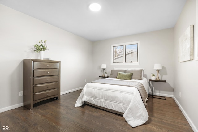 bedroom featuring dark hardwood / wood-style floors