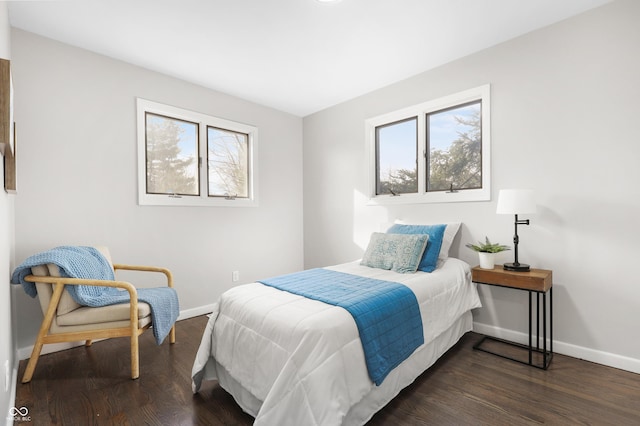 bedroom featuring dark hardwood / wood-style flooring