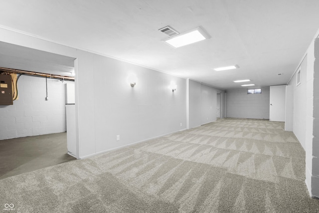 basement featuring light colored carpet