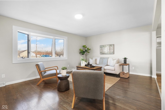 living room with dark hardwood / wood-style flooring