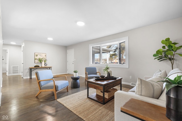 living room with dark hardwood / wood-style floors