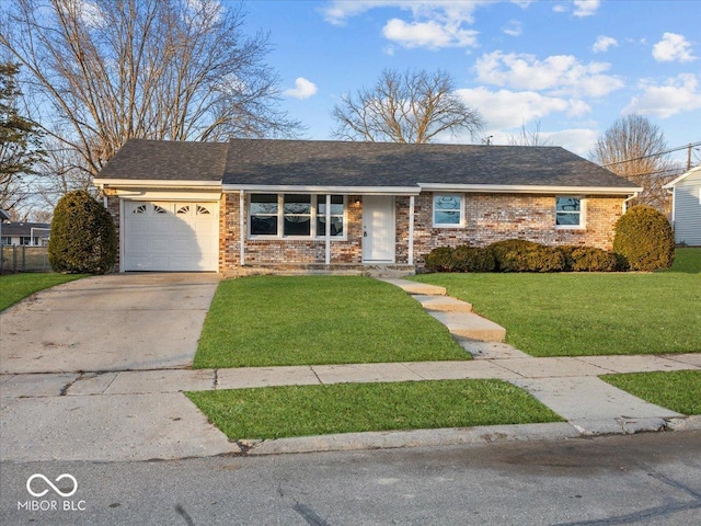 ranch-style home with a garage and a front yard