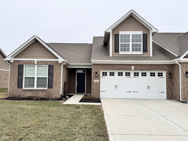 view of front facade with a garage and a front lawn