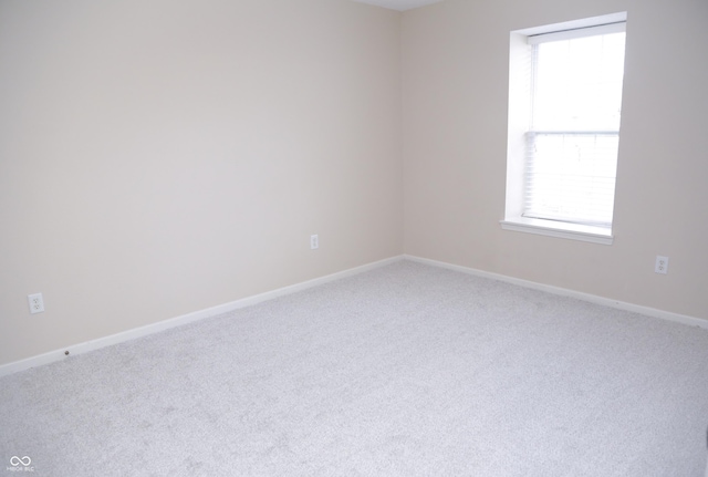 spare room featuring carpet