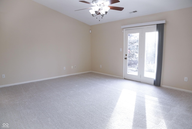 carpeted empty room featuring ceiling fan